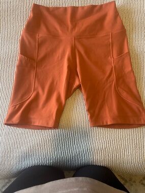 Nike Women's Bike Shorts in Rust Orange